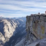 A side-view of Half Dome with Yosemite Valley in the background.